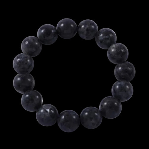 A black beaded stretch bracelet made of feldspar.